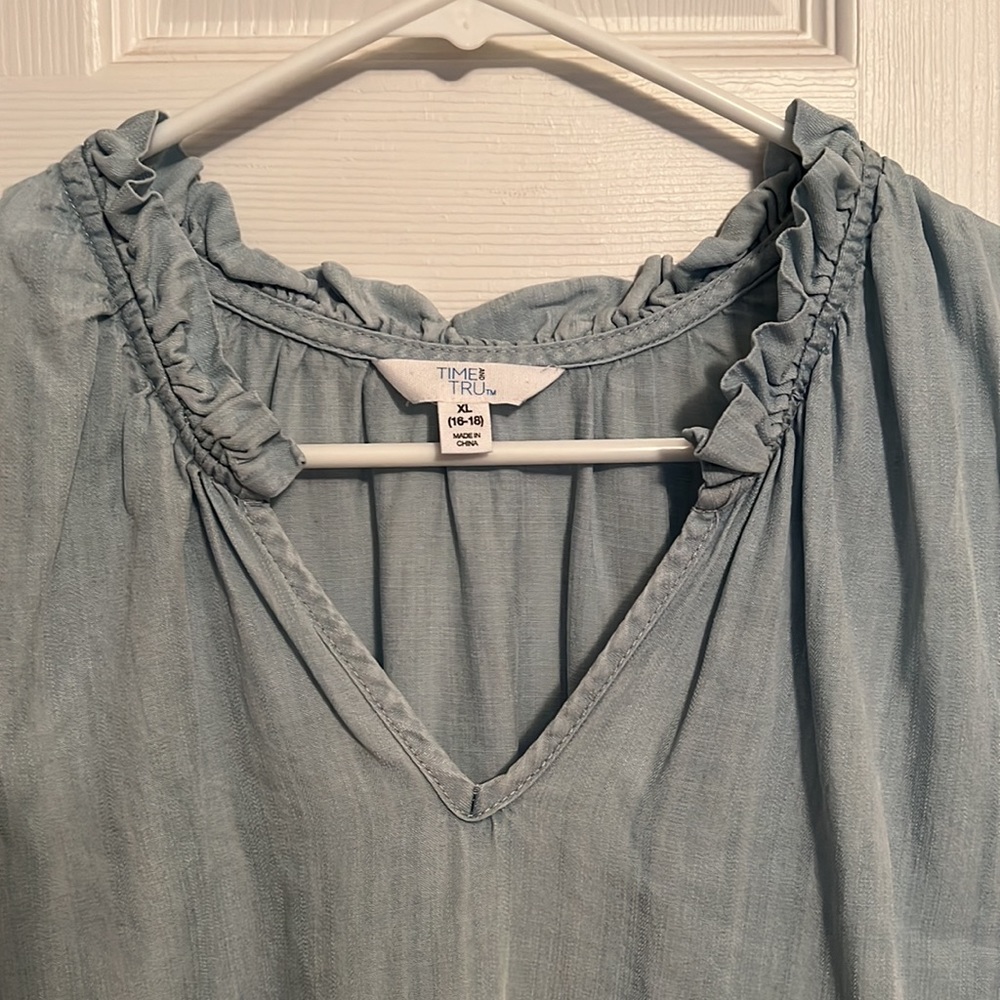 Ruffle neck sleeveless blouse